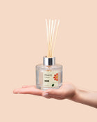 Diffuser in a clear glass bottle